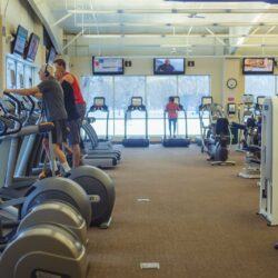 Three men using ellipticals at Parkside Fitness