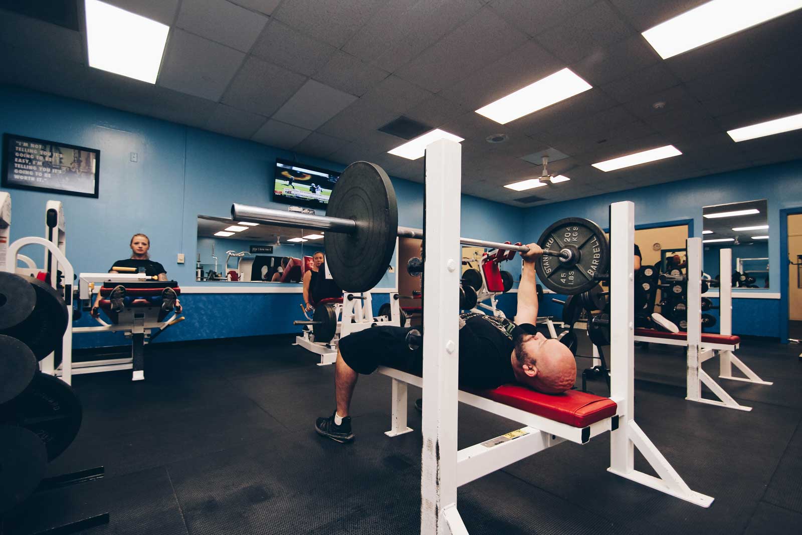 Man doing a bench press at Parkside Fitness