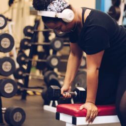 Woman doing a dumbbell row at Parkside Fitness