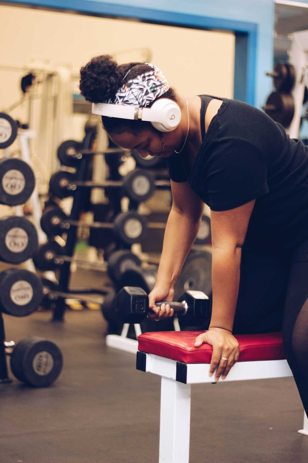 Woman doing a dumbbell row at Parkside Fitness