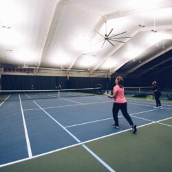 Doubles tennis match at Parkside Fitness