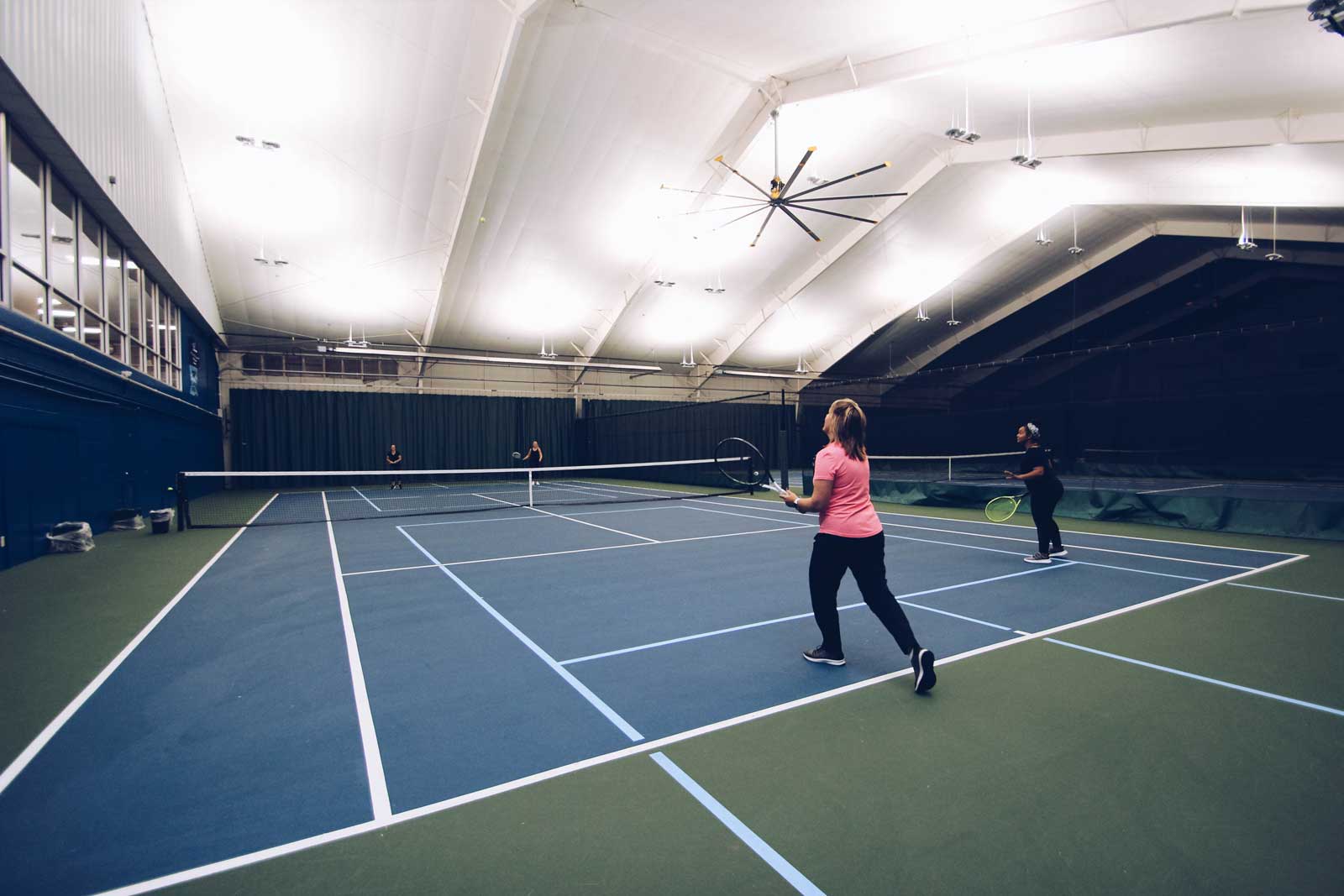 Doubles tennis match at Parkside Fitness