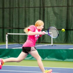 Girl returning a serve on the Pekin Park District tennis courts