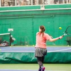 Woman playing tennis on the Pekin Park District tennis courts