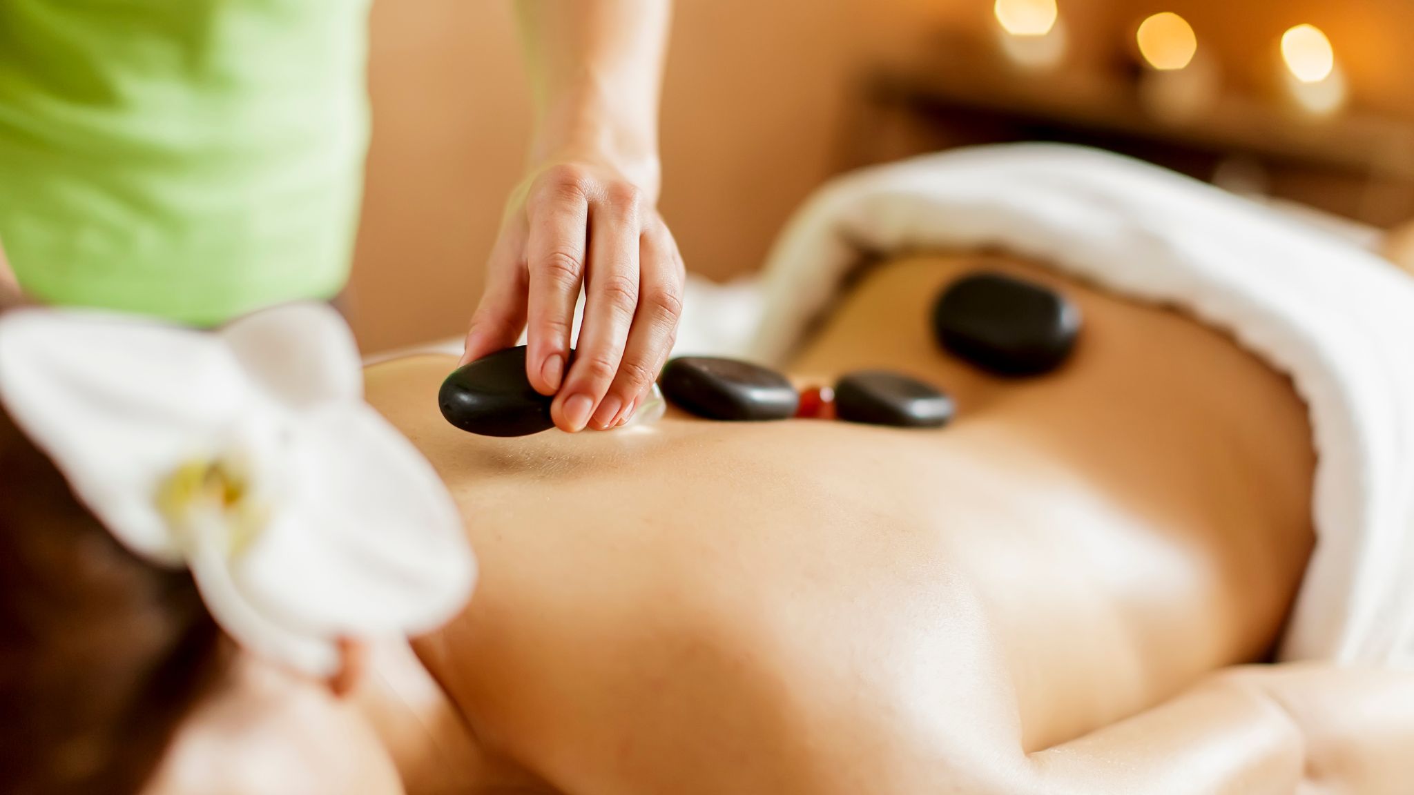 Woman receiving a hot stone massage