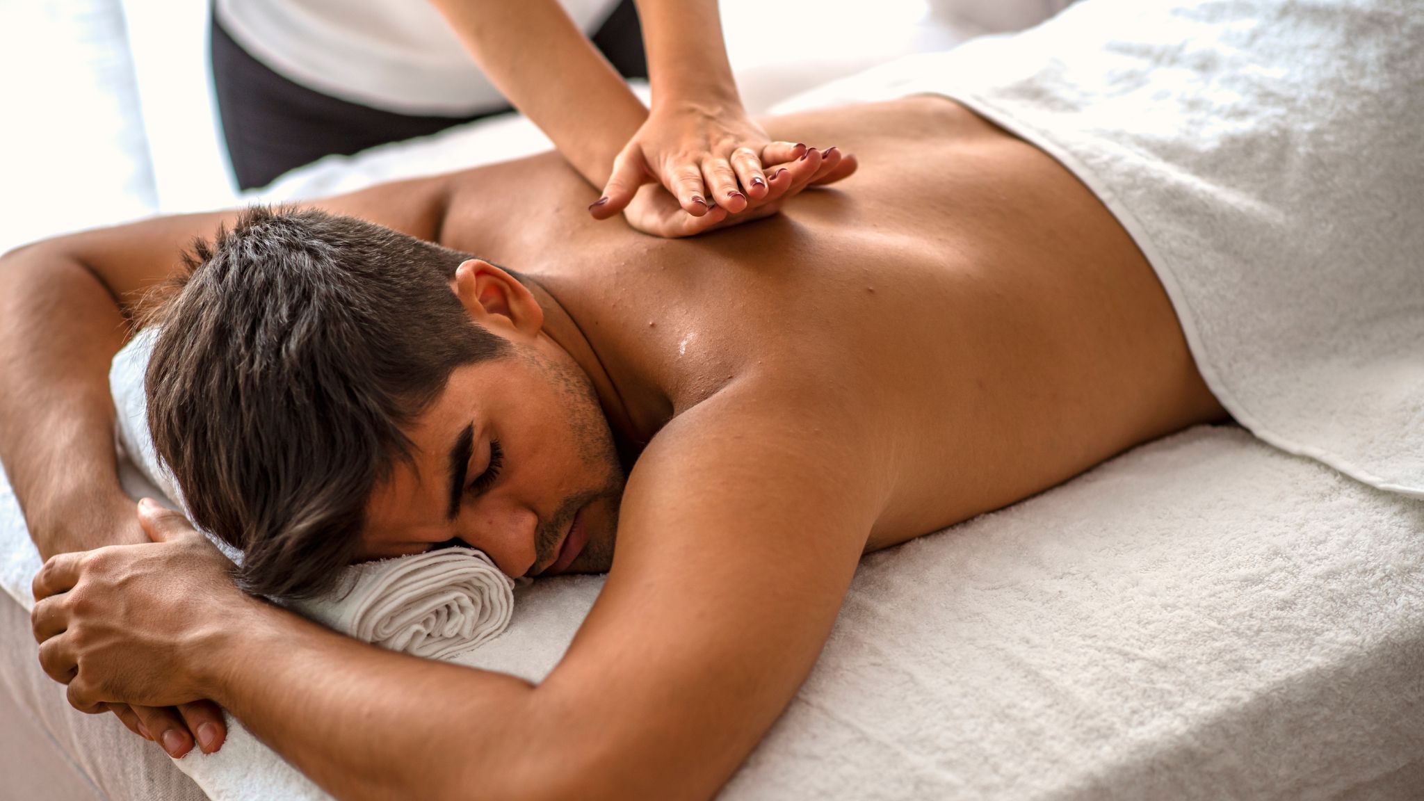 man receiving a back massage