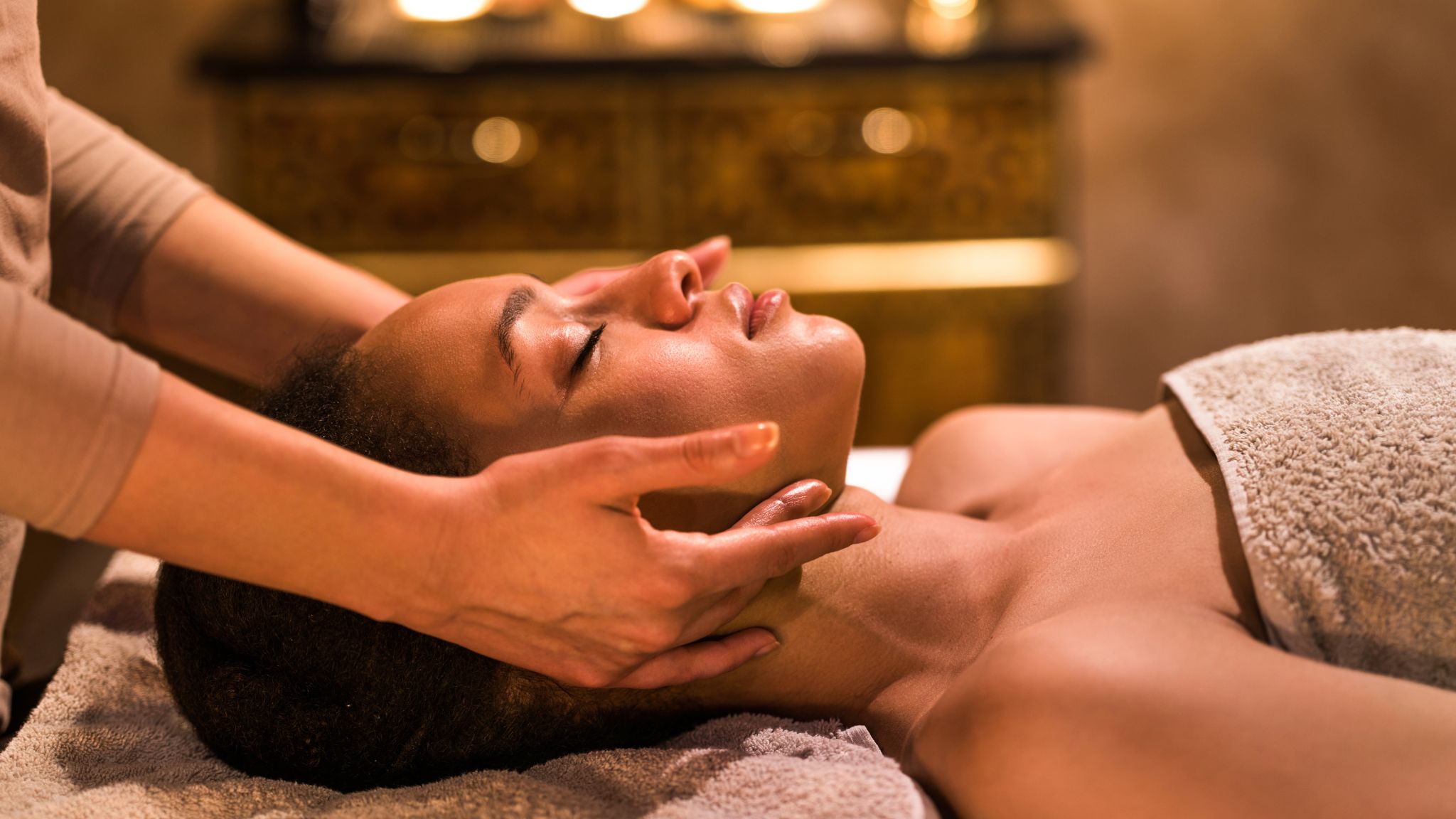 woman receiving a facial massage